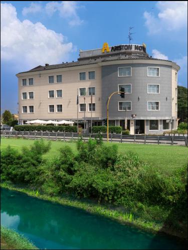 a building with a river in front of it at Hotel Ariston in Campodarsego