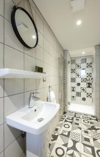 a bathroom with a sink and a mirror at The Litton in Litton