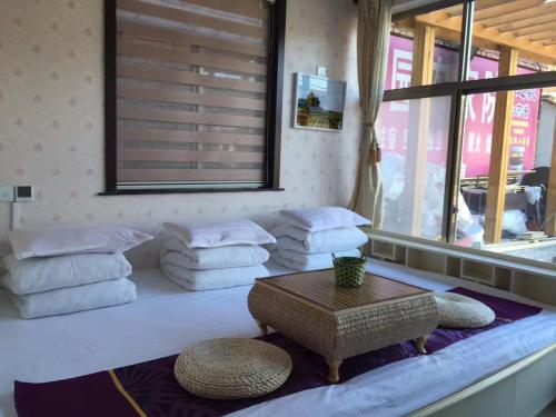 Postel nebo postele na pokoji v ubytování Huangyaguan Great Wall Li Bo Home Hotel