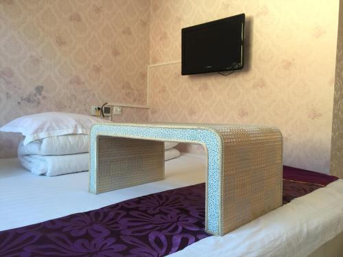 Postel nebo postele na pokoji v ubytování Huangyaguan Great Wall Li Bo Home Hotel