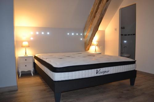 Posteľ alebo postele v izbe v ubytovaní Le Clos Masure