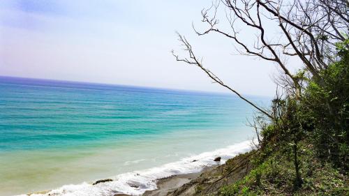a view of the ocean from a beach at Huxi B&B in Jian