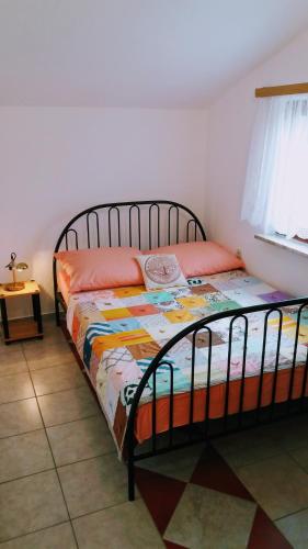 a bedroom with a bed in a room at Apartments Dada in Vir