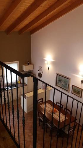 a living room with a table and a dining room at Villa Posta Vecchia in Loreo