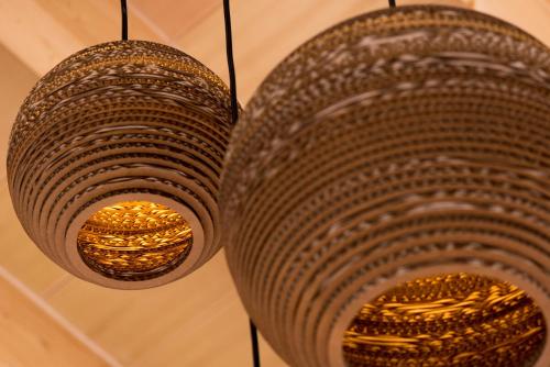 two chandeliers hanging from the ceiling in a room at Casa Font i Roig in Maria de la Salut