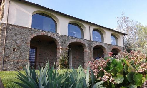 an external view of a brick building with windows at Antico Convento in Garessio