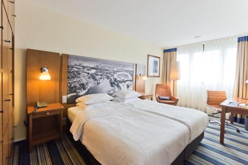 Postel nebo postele na pokoji v ubytování Arthotel Ana im Olympiapark