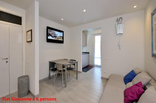 a living room with a couch and a table at Casa Rimidia FLAT GIOVANNA in Perugia