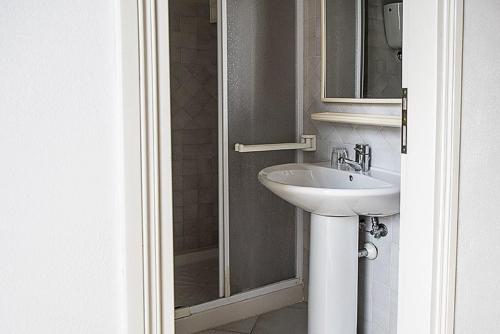 a bathroom with a sink and a shower at Salvatore 6 in Ponza