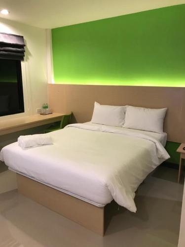 Ένα ή περισσότερα κρεβάτια σε δωμάτιο στο The Lephant Hotel