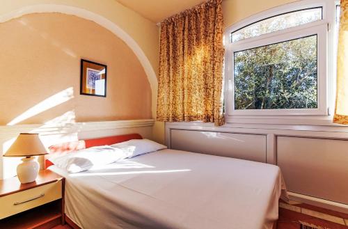 Postel nebo postele na pokoji v ubytování Villa Mare Apartments