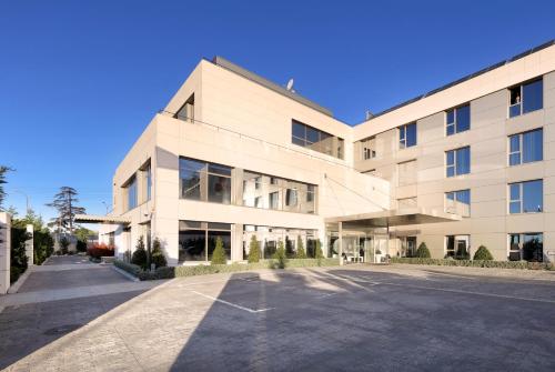 an empty parking lot in front of a building at Eurostars Arenas de Pinto in Pinto
