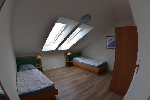 En eller flere senge i et værelse på Apartmentanlage Villa Granitz