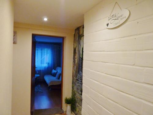 a hallway with a wall with a sign on it at Orzechowa Przystań in Ustka