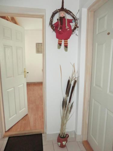 a hallway with a christmas ornament hanging on the wall at Pansion Izvor in Korenica