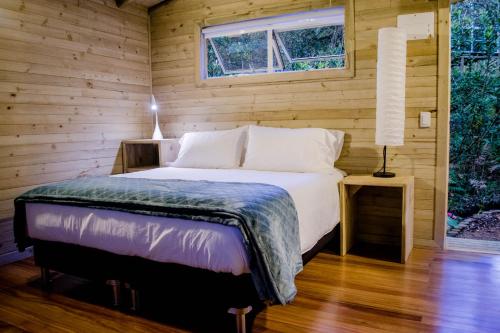 سرير أو أسرّة في غرفة في Monte Helicón Spa