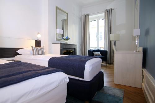 Postel nebo postele na pokoji v ubytování La Suite Terreaux
