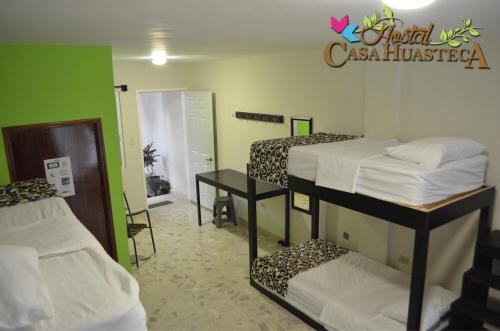 Ένα ή περισσότερα κρεβάτια σε δωμάτιο στο Hostal Casa Huasteca
