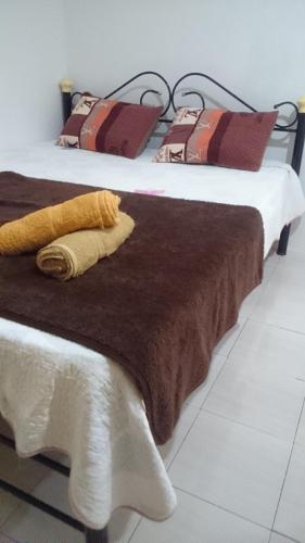 two beds sitting next to each other in a room at Arina`s Homestay in Kuala Besut