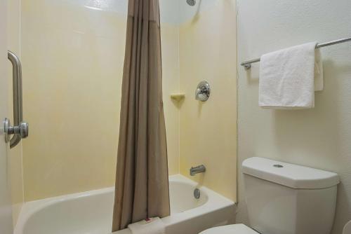 a bathroom with a white toilet and a shower at Motel 6-Tucker, GA - Atlanta Northeast in Tucker