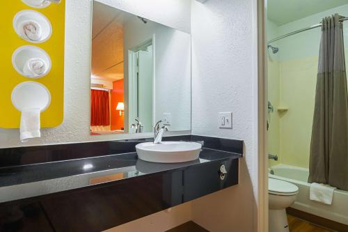 a bathroom with a sink and a toilet at Motel 6-Tucker, GA - Atlanta Northeast in Tucker