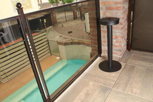 a swimming pool in the floor of a balcony at Luna Residence Hotel in Casalmaggiore
