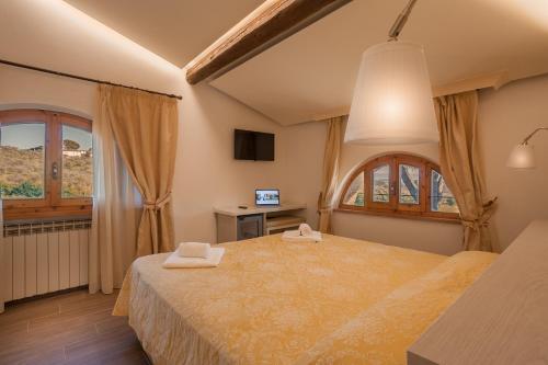 מיטה או מיטות בחדר ב-Hotel Villa San Giorgio