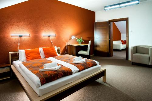Postel nebo postele na pokoji v ubytování Hotel Bystricka