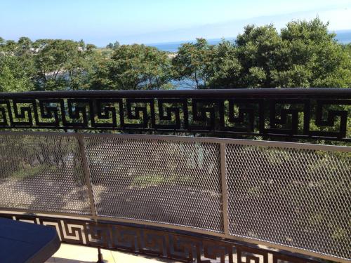 a fence with a sign on top of it at Family Hotel Diana in Tsarevo