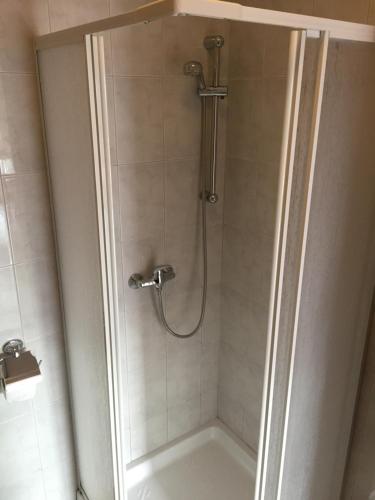 a bathroom with a shower with a sink and a tub at Sunny Rock Volme Apartments in Banjole