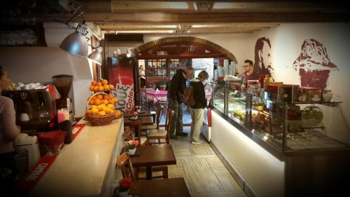 a group of people standing in a grocery store aisle at Pietra Suite in Monemvasia