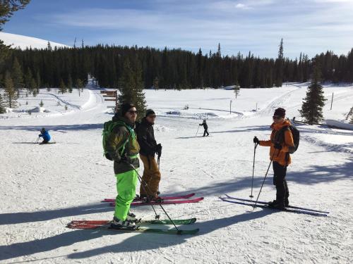 a group of people standing on skis in the snow at Ylläksen Yöpuu in Äkäslompolo