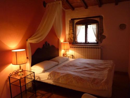 Postel nebo postele na pokoji v ubytování Podere La Fornace