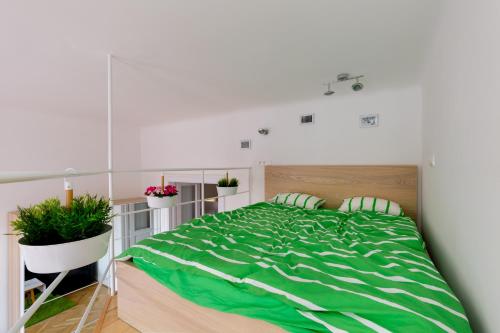 Posteľ alebo postele v izbe v ubytovaní F4 Fiumei Apartment