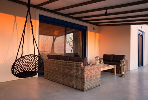 a living room with a couch and a table at Blue Fort Villas in Methoni