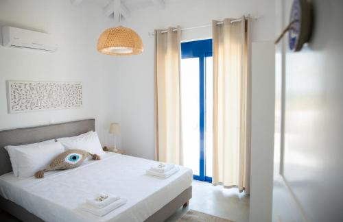 Ένα ή περισσότερα κρεβάτια σε δωμάτιο στο Blue Fort Villas