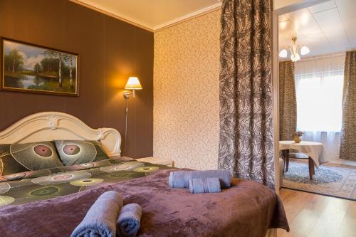 a bedroom with a bed with a face pillow on it at Prenzel Apartments in Pärnu