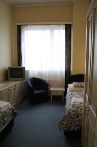 Postel nebo postele na pokoji v ubytování Hotel Bila Ruze