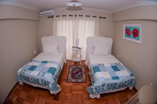 Ένα ή περισσότερα κρεβάτια σε δωμάτιο στο Hostal Pehuenche