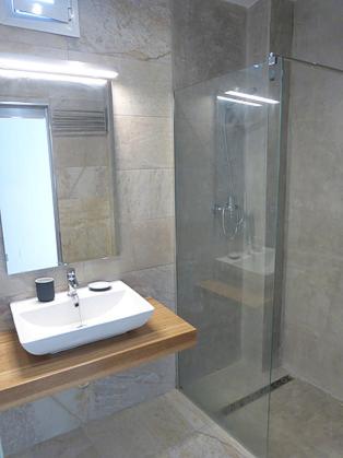 a bathroom with a sink and a glass shower at Victoria Luxury Penthouse in Málaga