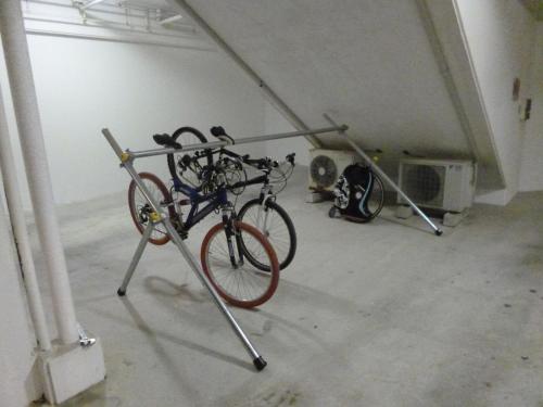 a bike on a rack in a garage at Hotel Sha La La in Okinawa City