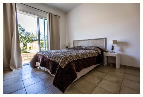 Postel nebo postele na pokoji v ubytování Villa 4 étoiles Sole di Corsica