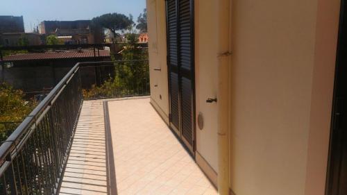 a balcony with a door and a view at SWEET HOME GIULIA Locazione ad uso turistico in Cimitile