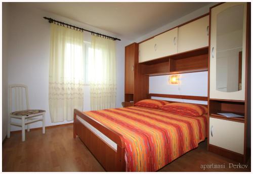 Postel nebo postele na pokoji v ubytování Apartments Primosten, Dolac