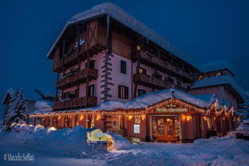 a large building with a ski lift on top of it at Hotel Belvedere in San Martino di Castrozza