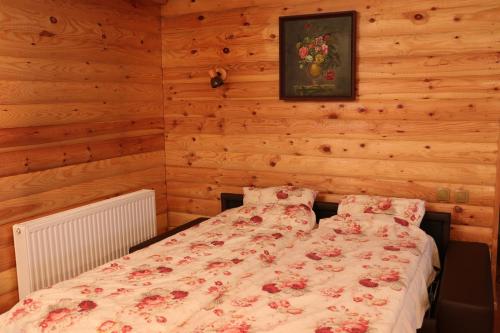 En eller flere senger på et rom på Sauna House in North of Lithuania