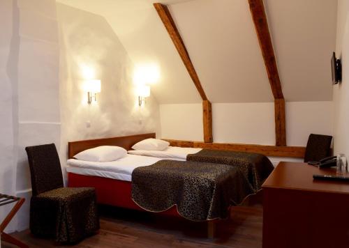 Кровать или кровати в номере Gotthard Residents