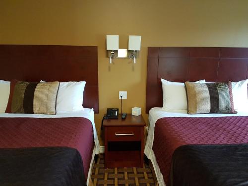 Cama o camas de una habitación en Fox Motor Inn
