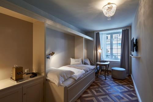 Postel nebo postele na pokoji v ubytování Boutique Hotel La Couronne