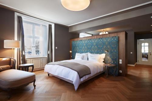 Ein Bett oder Betten in einem Zimmer der Unterkunft Boutique Hotel La Couronne